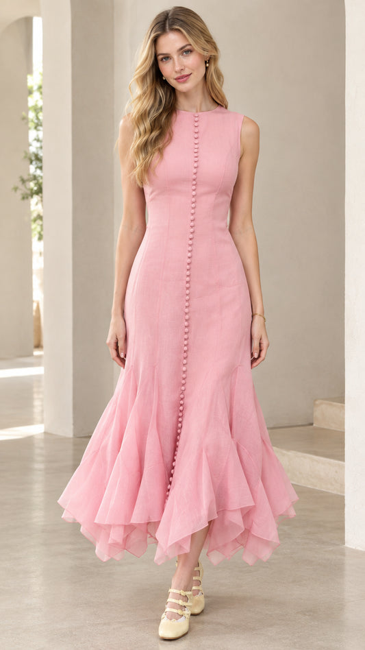 Front full-length view of woman wearing pink sleeveless button-front mermaid midi dress with ruffled hem